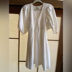 White babydoll dress. Size small (fits up to large depending on fit)